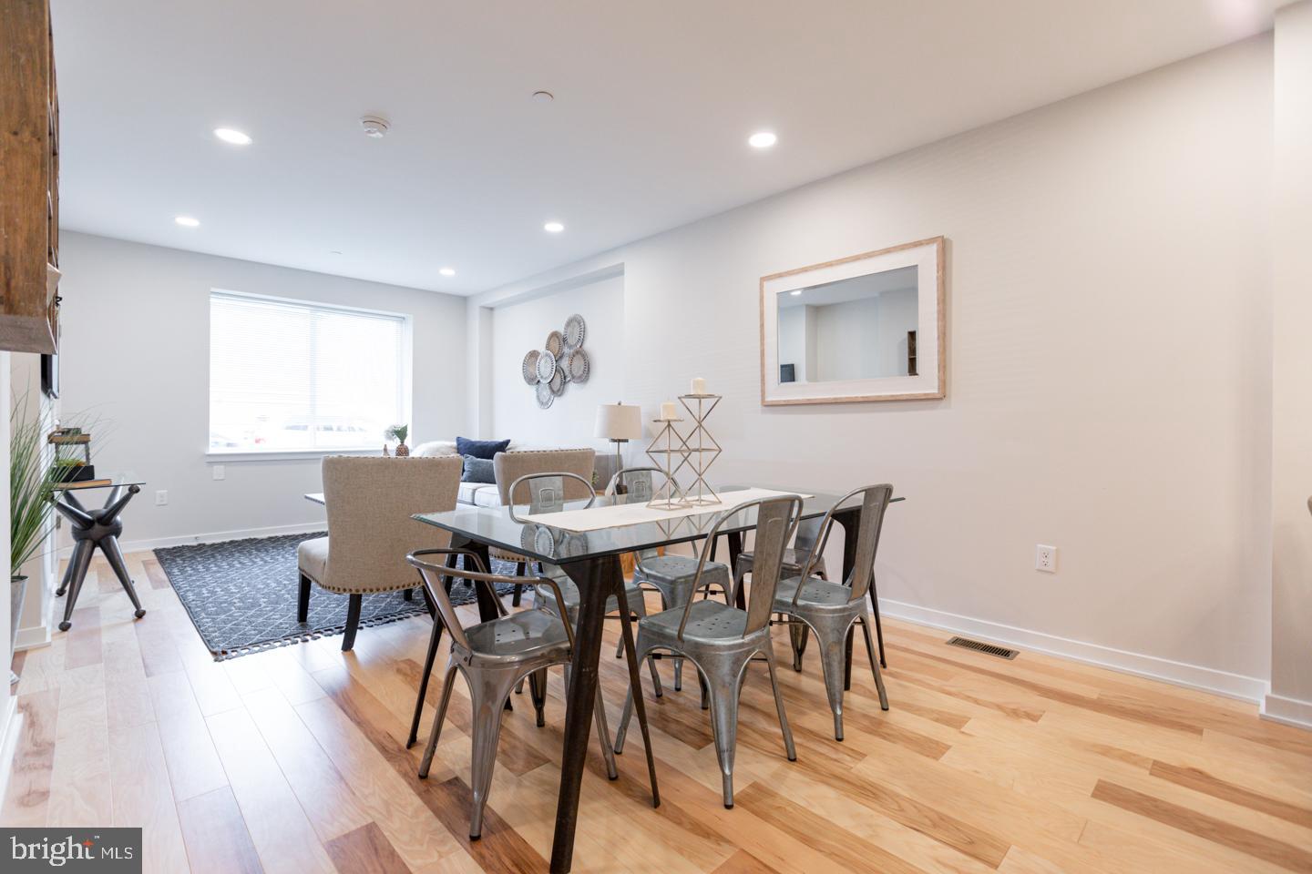 1322 Hope Street, Unit A Philadelphia, PA 19122 - Photo 8 of 30 a view of a dining room with furniture and wooden floor