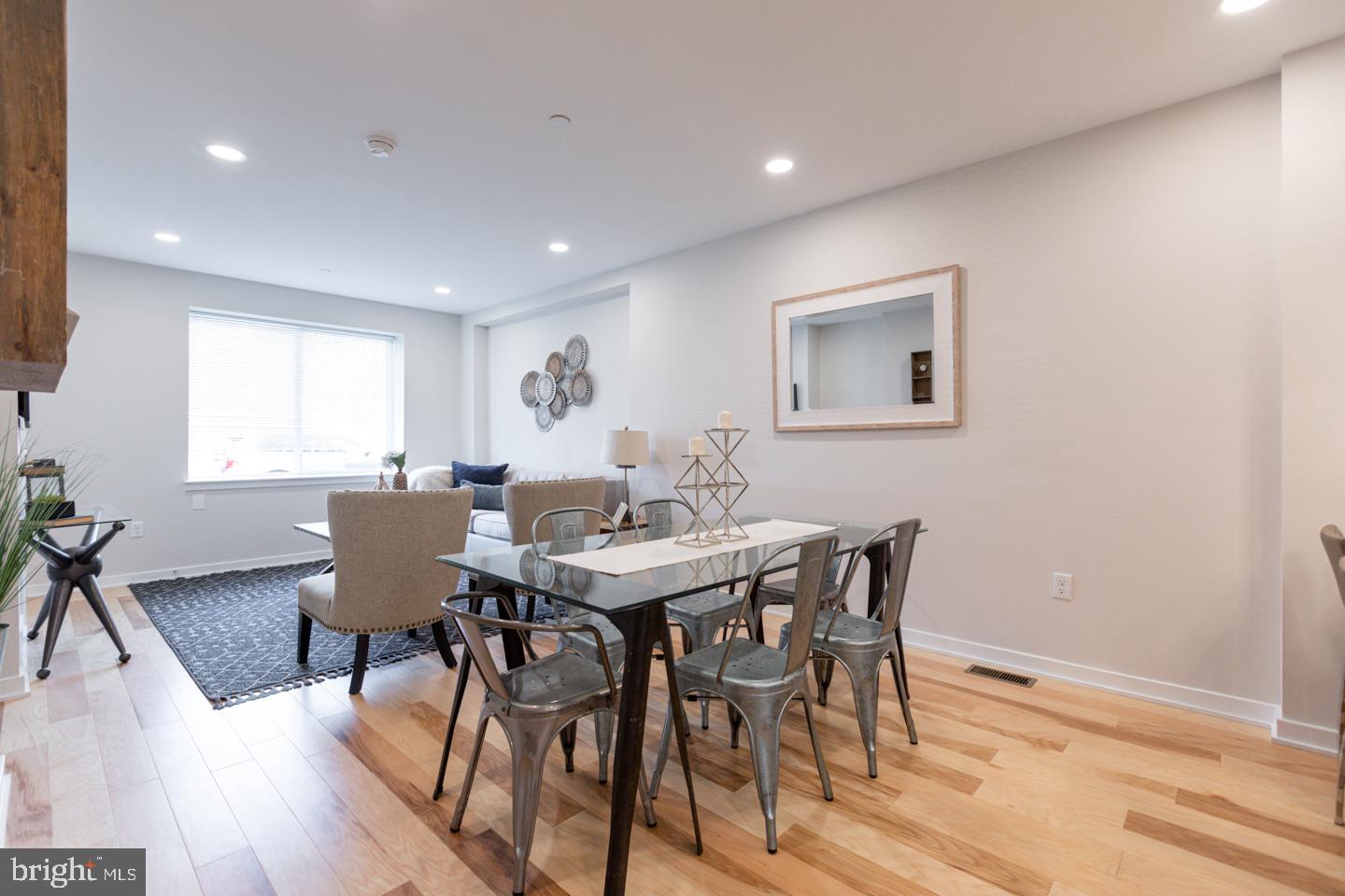 1322 Hope Street, Unit A Philadelphia, PA 19122 - Photo 9 of 30 a view of a dining room with furniture and wooden floor
