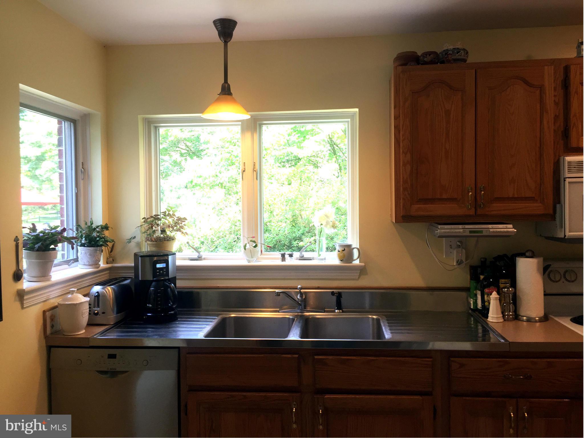 910 Notley Road Silver Spring, MD 20904 - Photo 14 of 28 a kitchen with a sink cabinets and window
