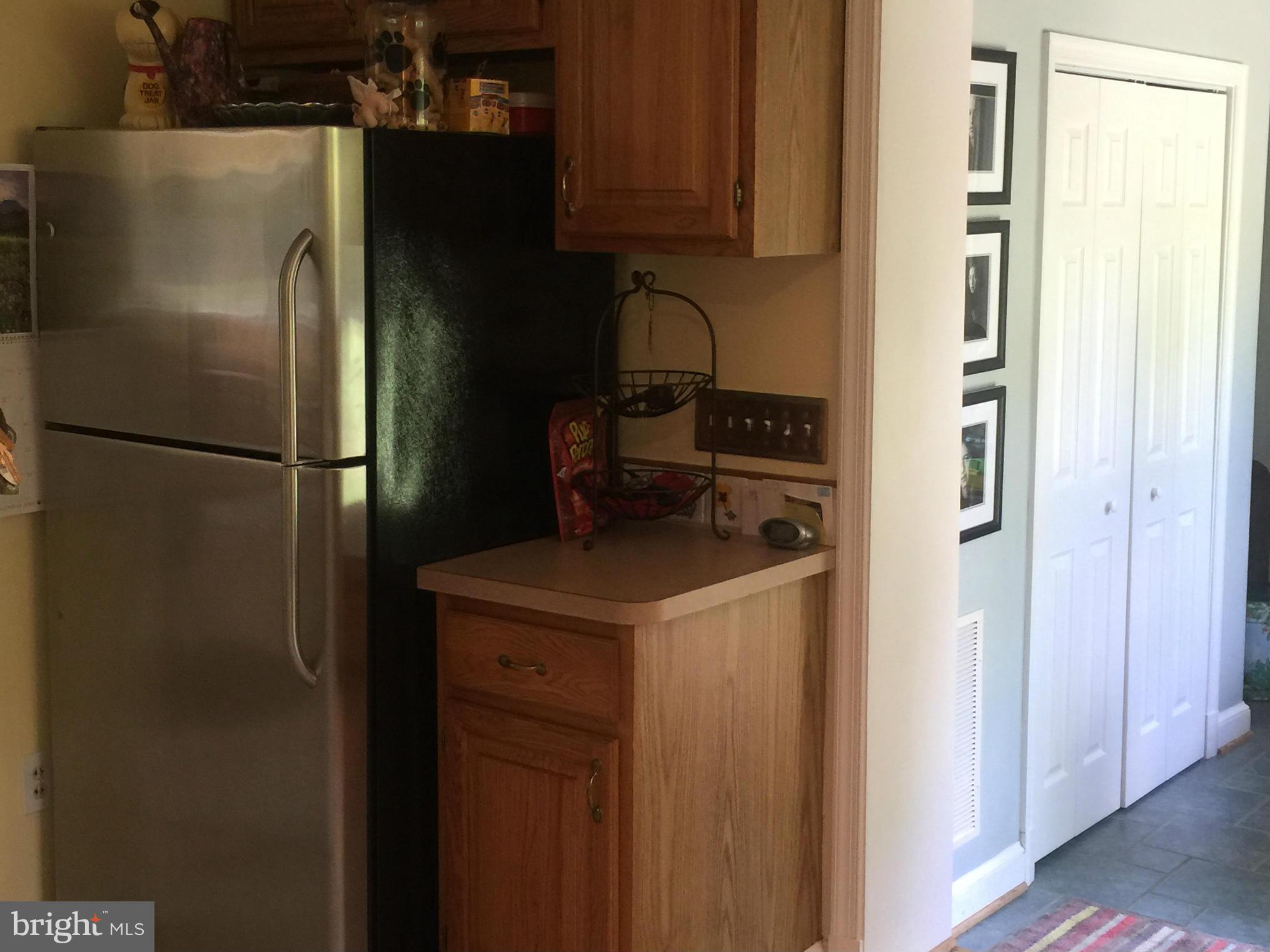 910 Notley Road Silver Spring, MD 20904 - Photo 15 of 28 a kitchen with metallic refrigerator freezer and a dishwasher