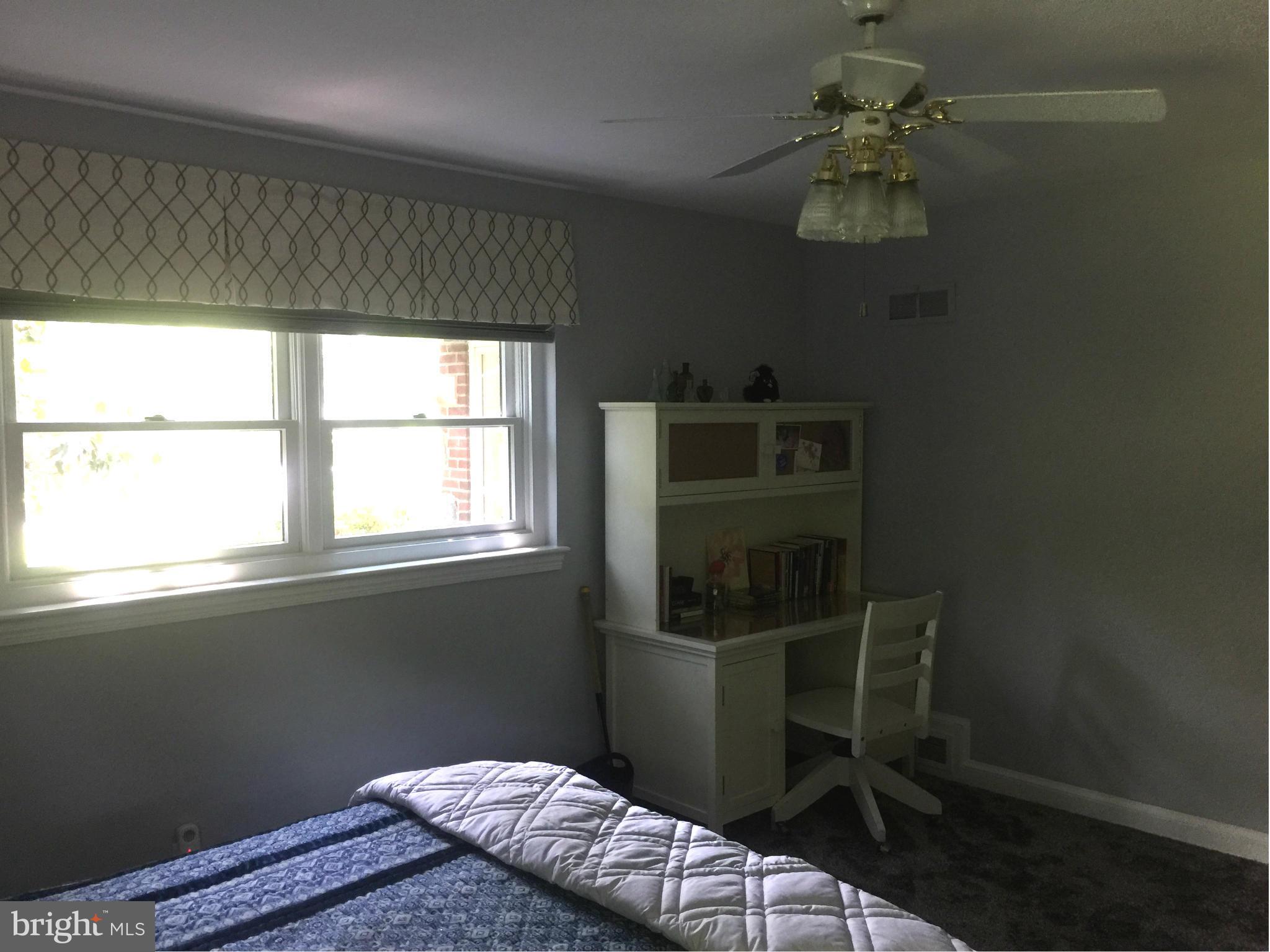 910 Notley Road Silver Spring, MD 20904 - Photo 25 of 28 a bedroom with a bed and a window