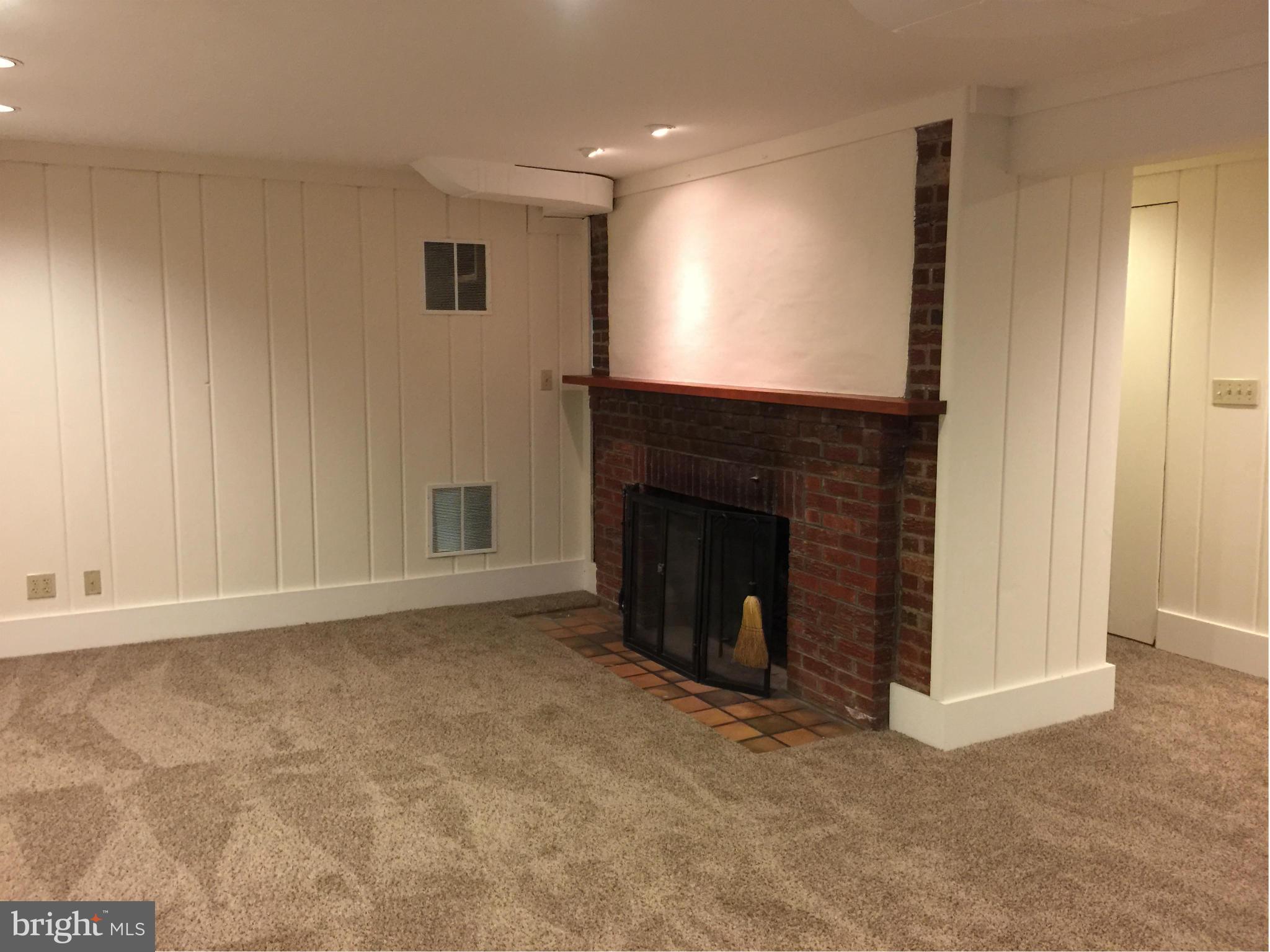 910 Notley Road Silver Spring, MD 20904 - Photo 26 of 28 a view of an empty room with a fireplace