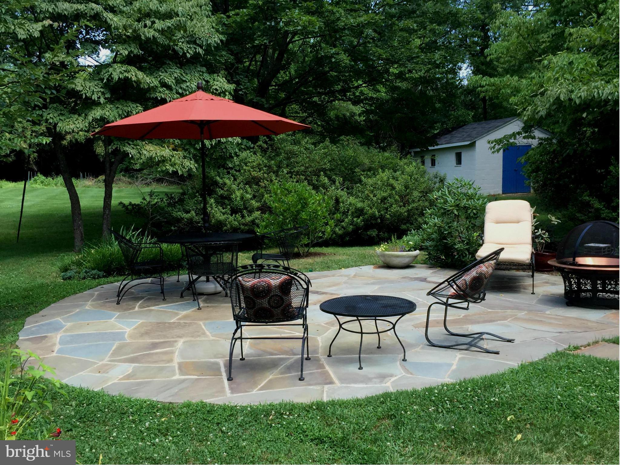 910 Notley Road Silver Spring, MD 20904 - Photo 4 of 28 a view of backyard with sitting area and a slide