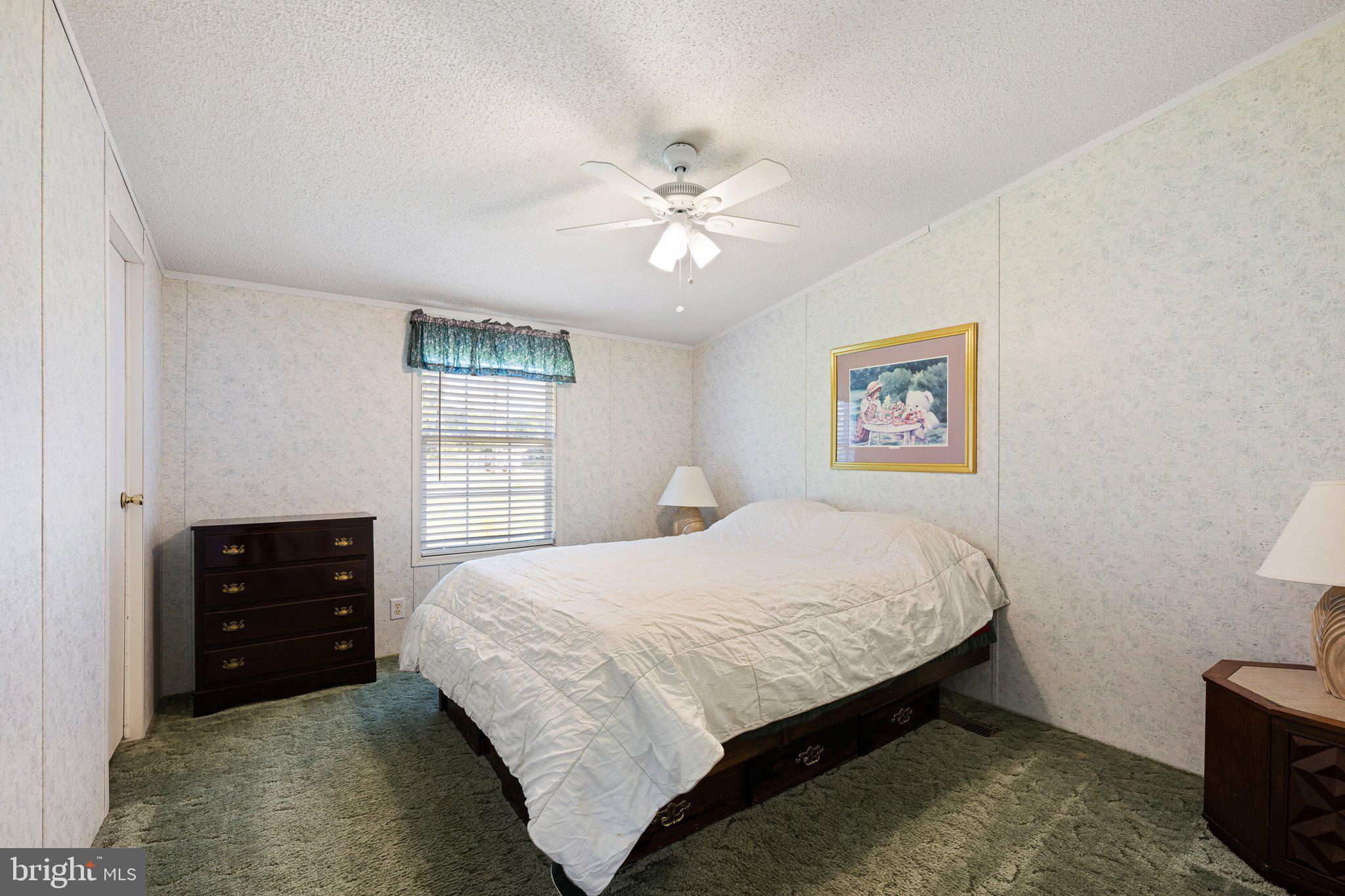 29044 Log Cabin Hill Road Lewes, DE 19958 - Photo 19 of 36 a bedroom with a bed and a closet