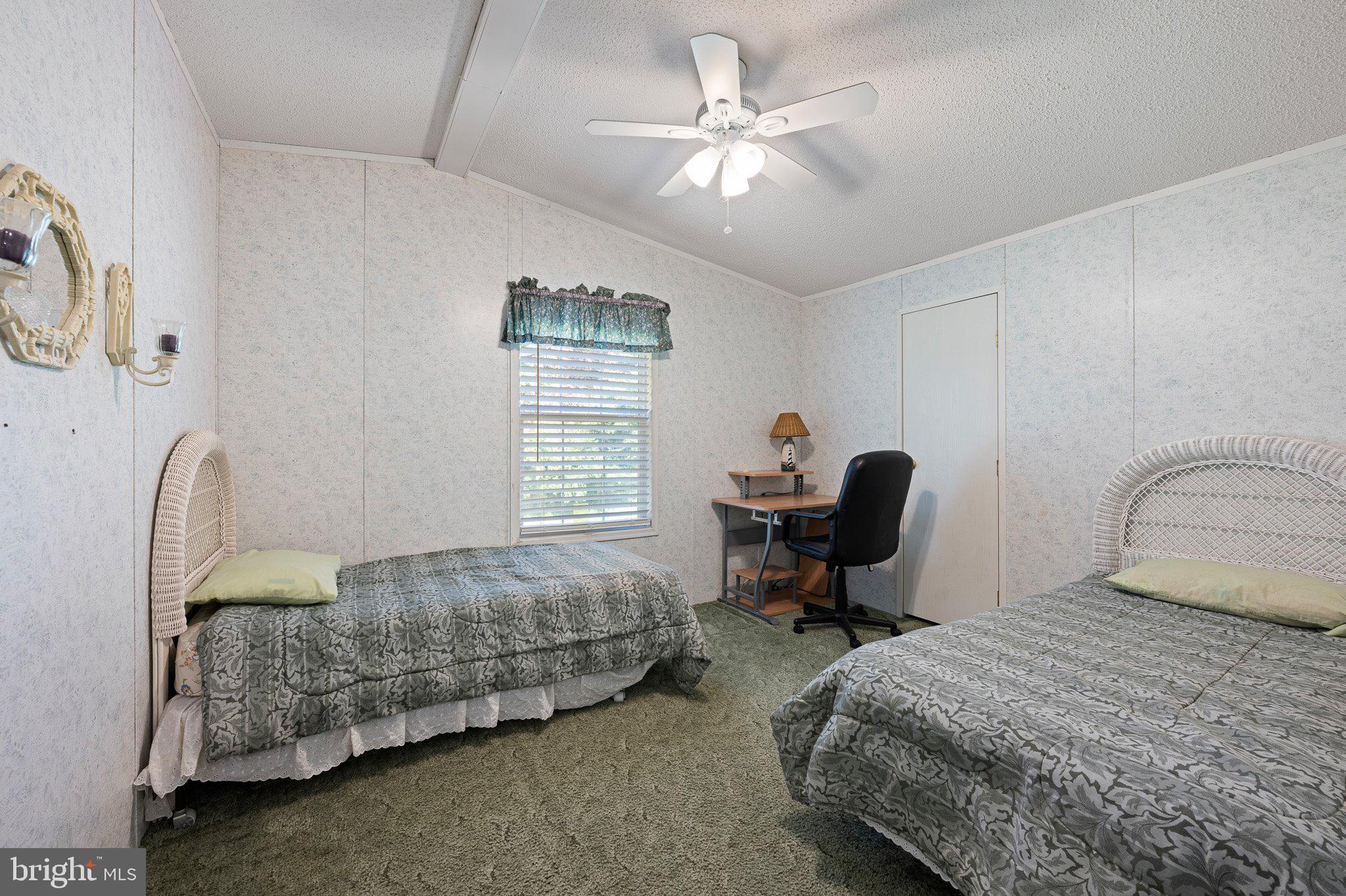 29044 Log Cabin Hill Road Lewes, DE 19958 - Photo 24 of 36 a bedroom with bed and a window