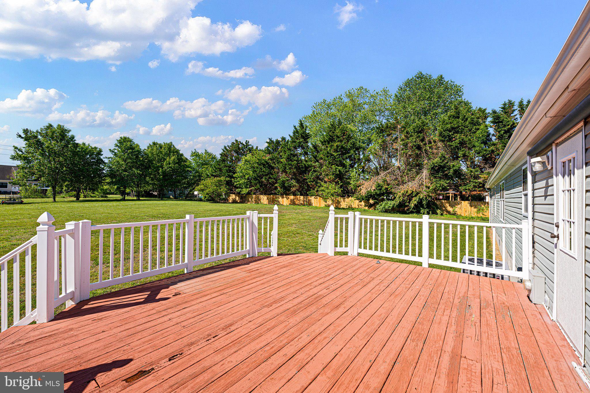 29044 Log Cabin Hill Road Lewes, DE 19958 - Photo 27 of 36 a balcony with wooden floor and fence
