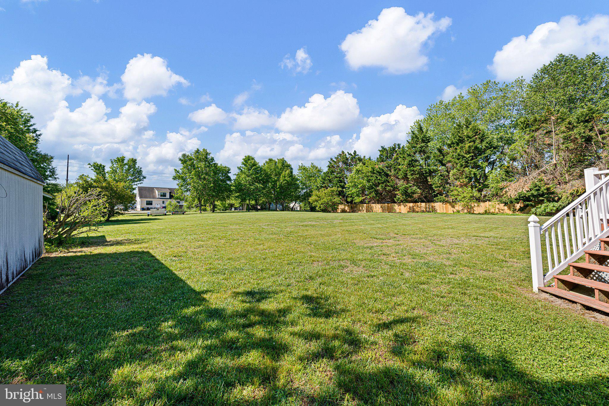 29044 Log Cabin Hill Road Lewes, DE 19958 - Photo 28 of 36 a view of a golf course with a lake