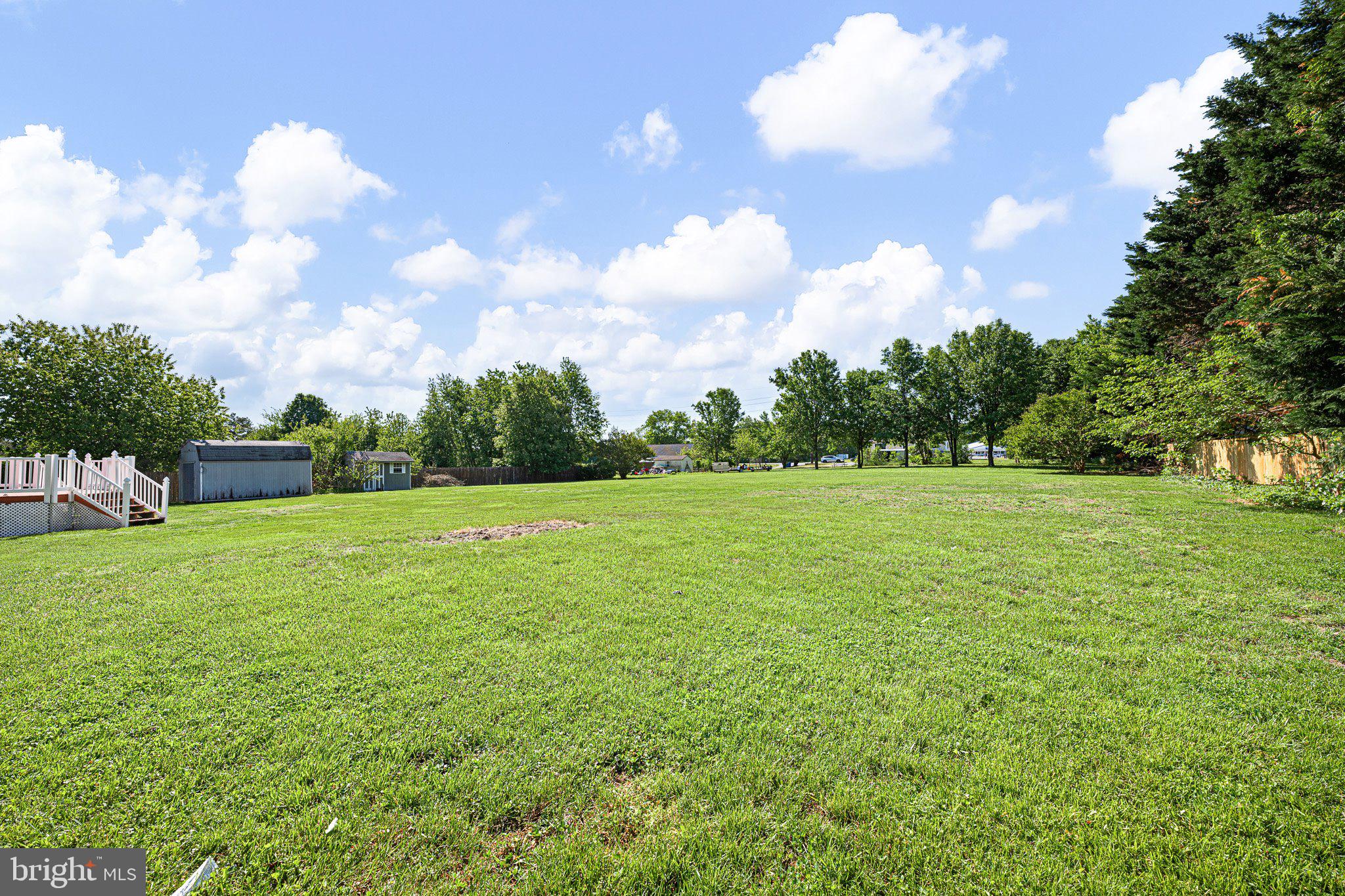 29044 Log Cabin Hill Road Lewes, DE 19958 - Photo 29 of 36 a view of a green field with wooden fence