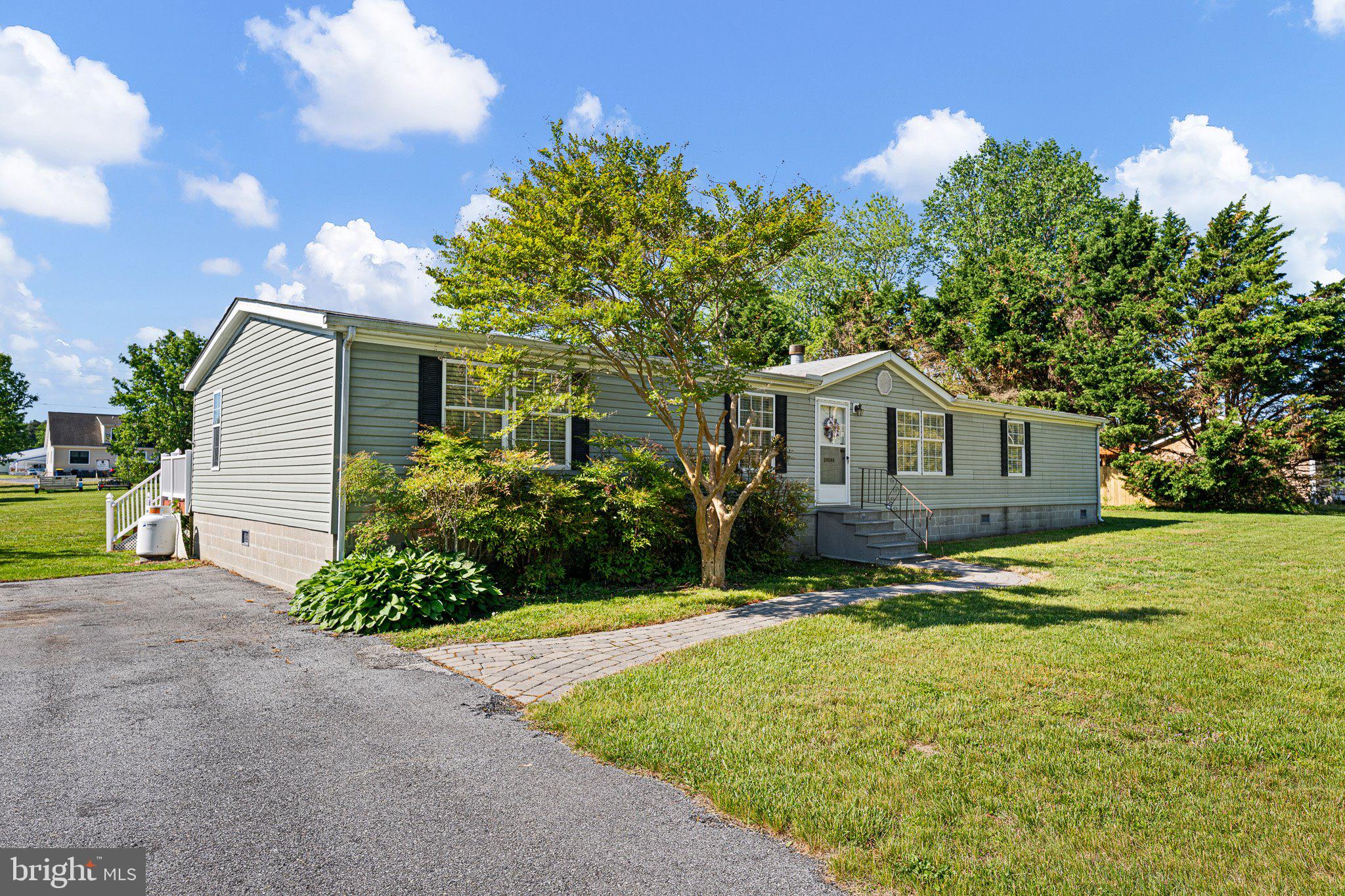 29044 Log Cabin Hill Road Lewes, DE 19958 - Photo 3 of 36 a house view with a garden space