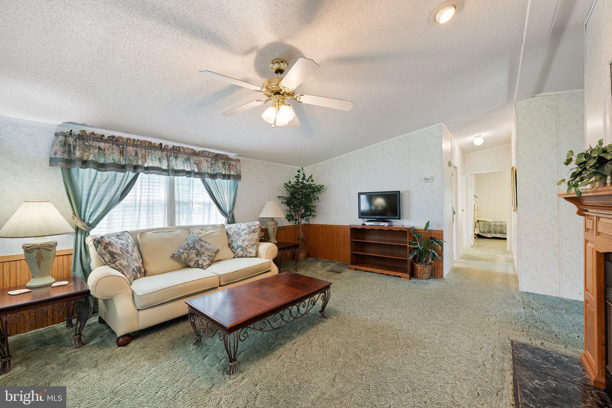 29044 Log Cabin Hill Road Lewes, DE 19958 - Photo 7 of 36 a living room with furniture and a large window