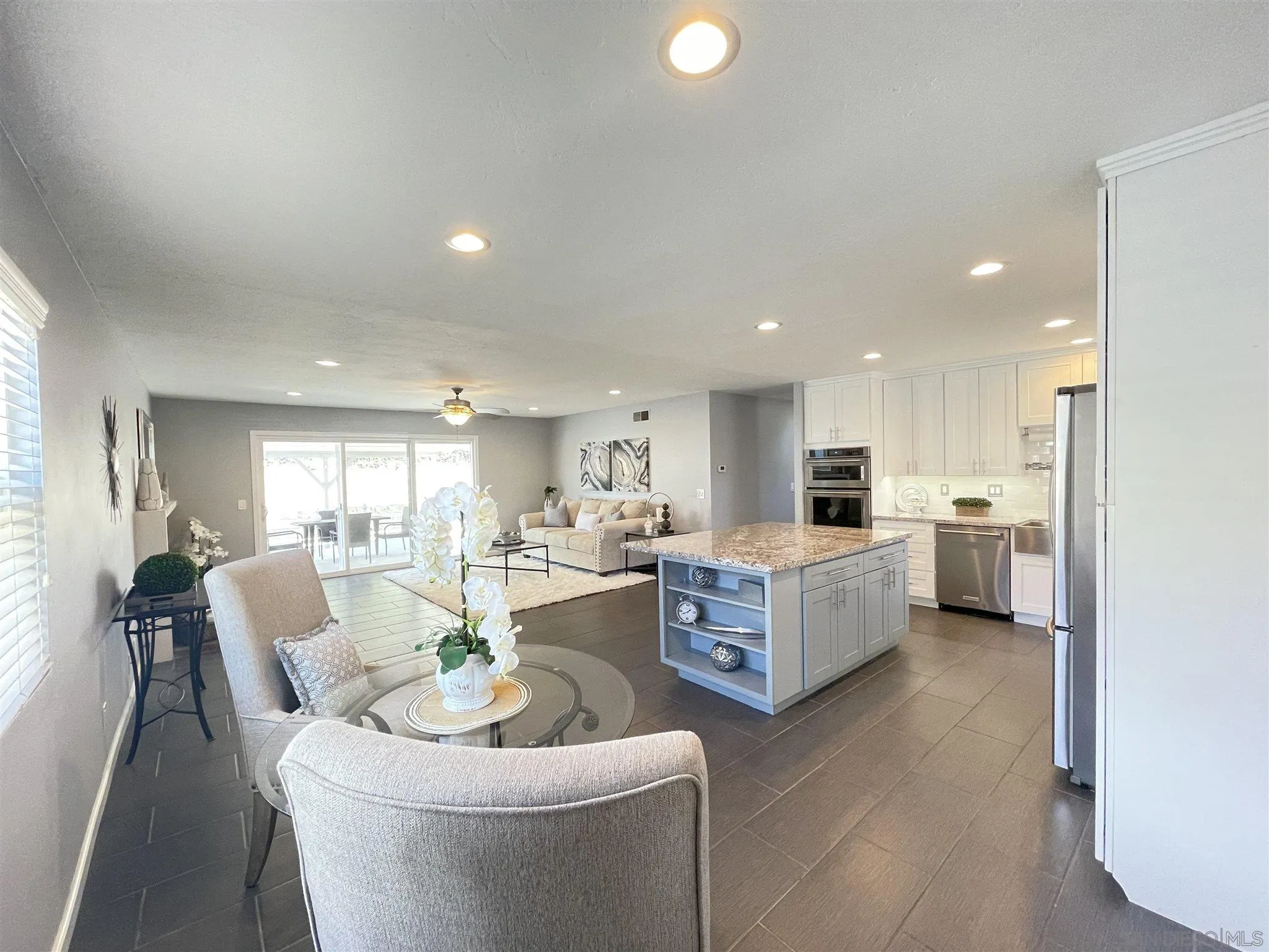 13717 Tobiasson Road Poway, CA 92064 - Photo 1 of 13 a living room with furniture and a large window