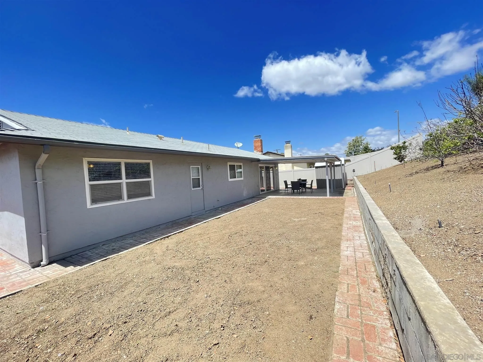 13717 Tobiasson Road Poway, CA 92064 - Photo 11 of 13 a view of a house with a snow in the yard