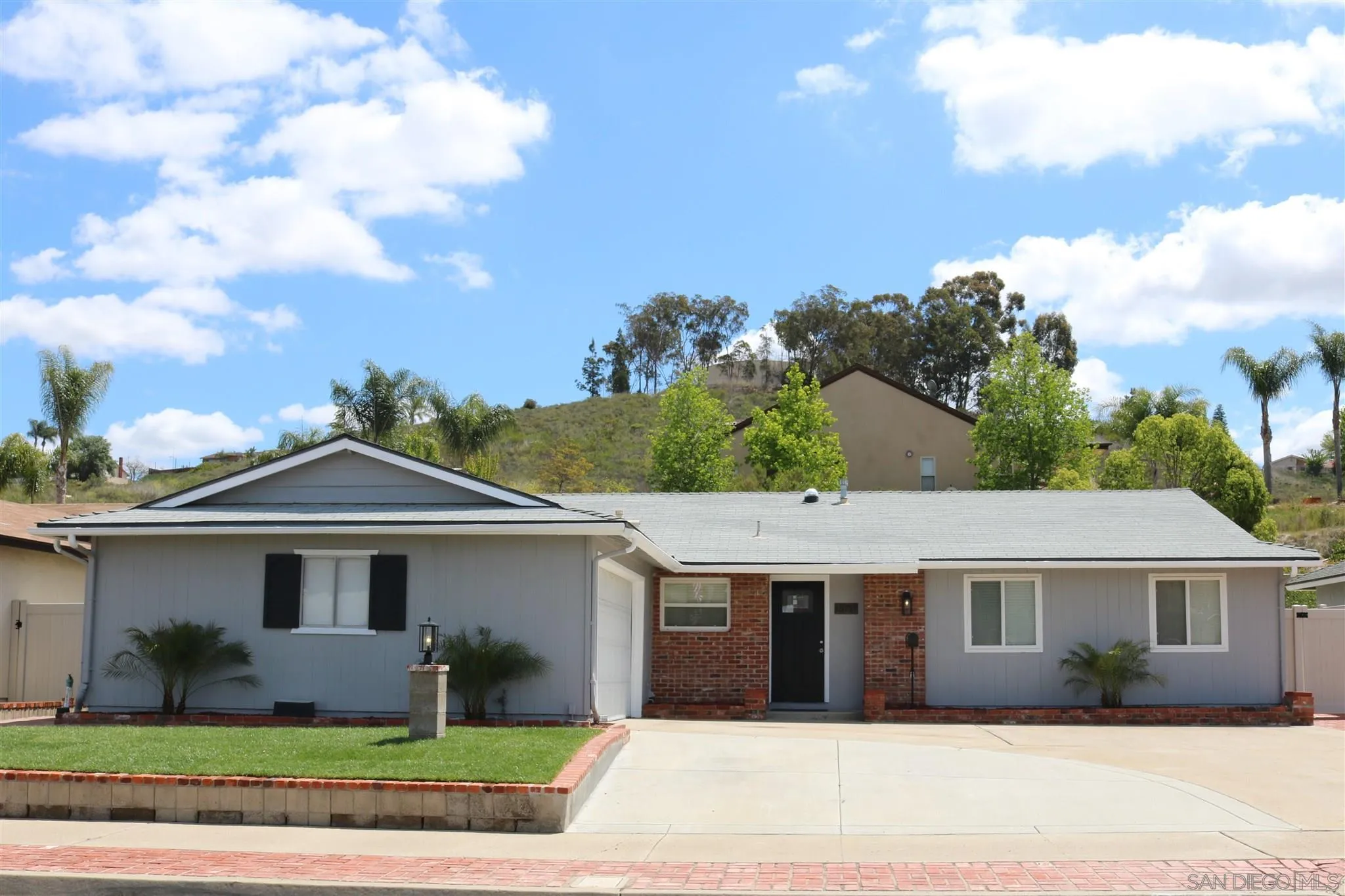 13717 Tobiasson Road Poway, CA 92064 - Photo 12 of 13 a front view of a house with a garden