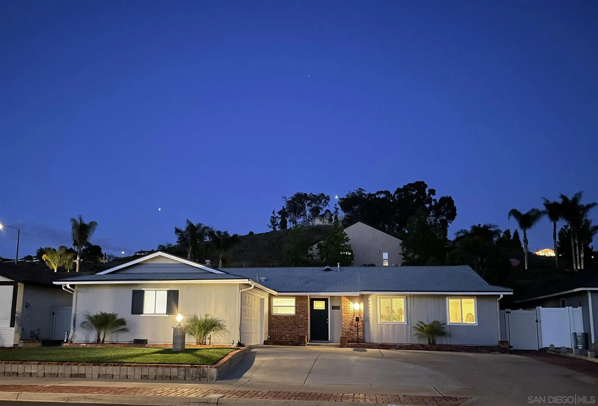 13717 Tobiasson Road Poway, CA 92064 - Photo 13 of 13 a front view of a house with a yard and garage