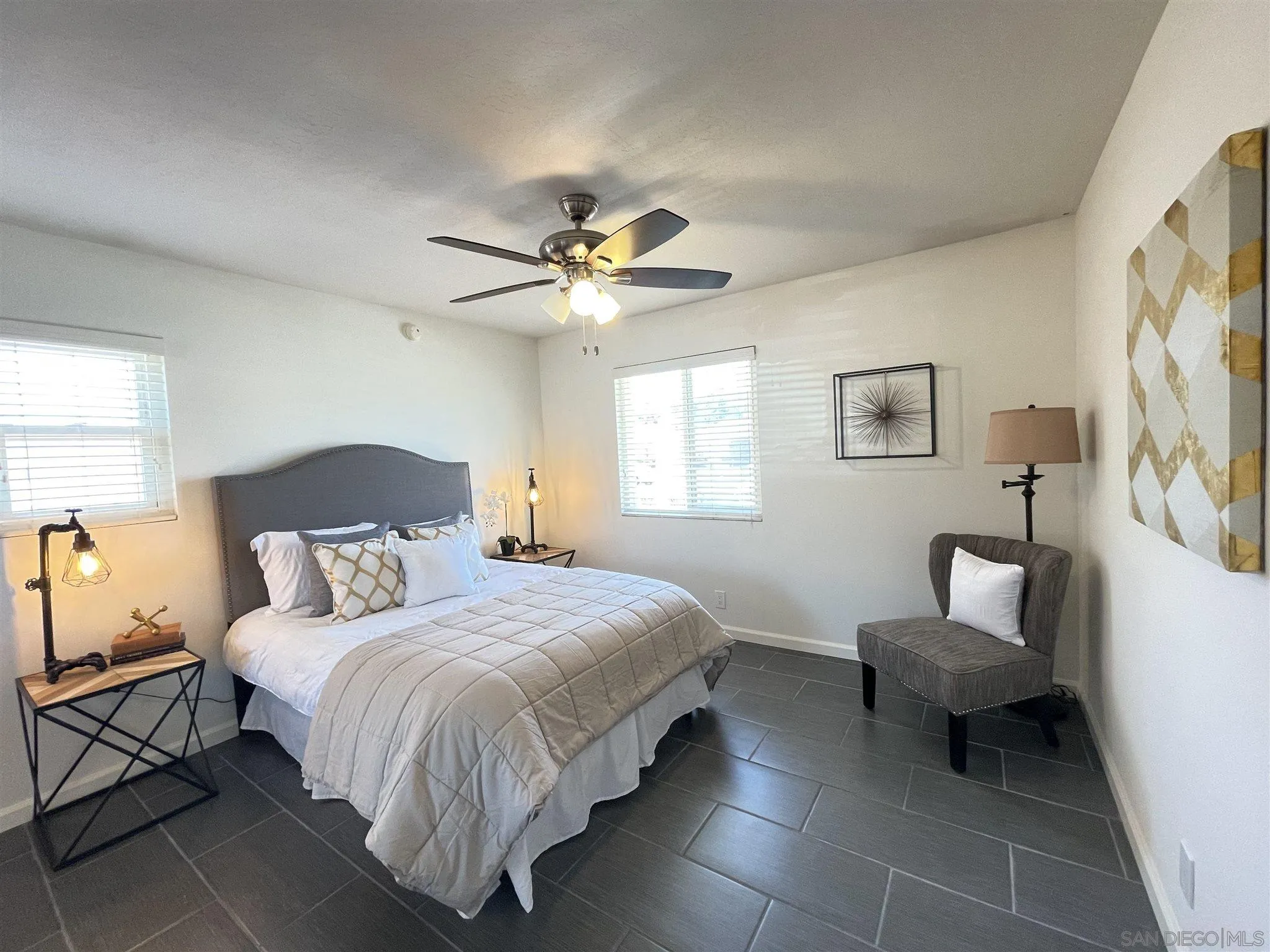 13717 Tobiasson Road Poway, CA 92064 - Photo 6 of 13 a bedroom with a bed and a chair