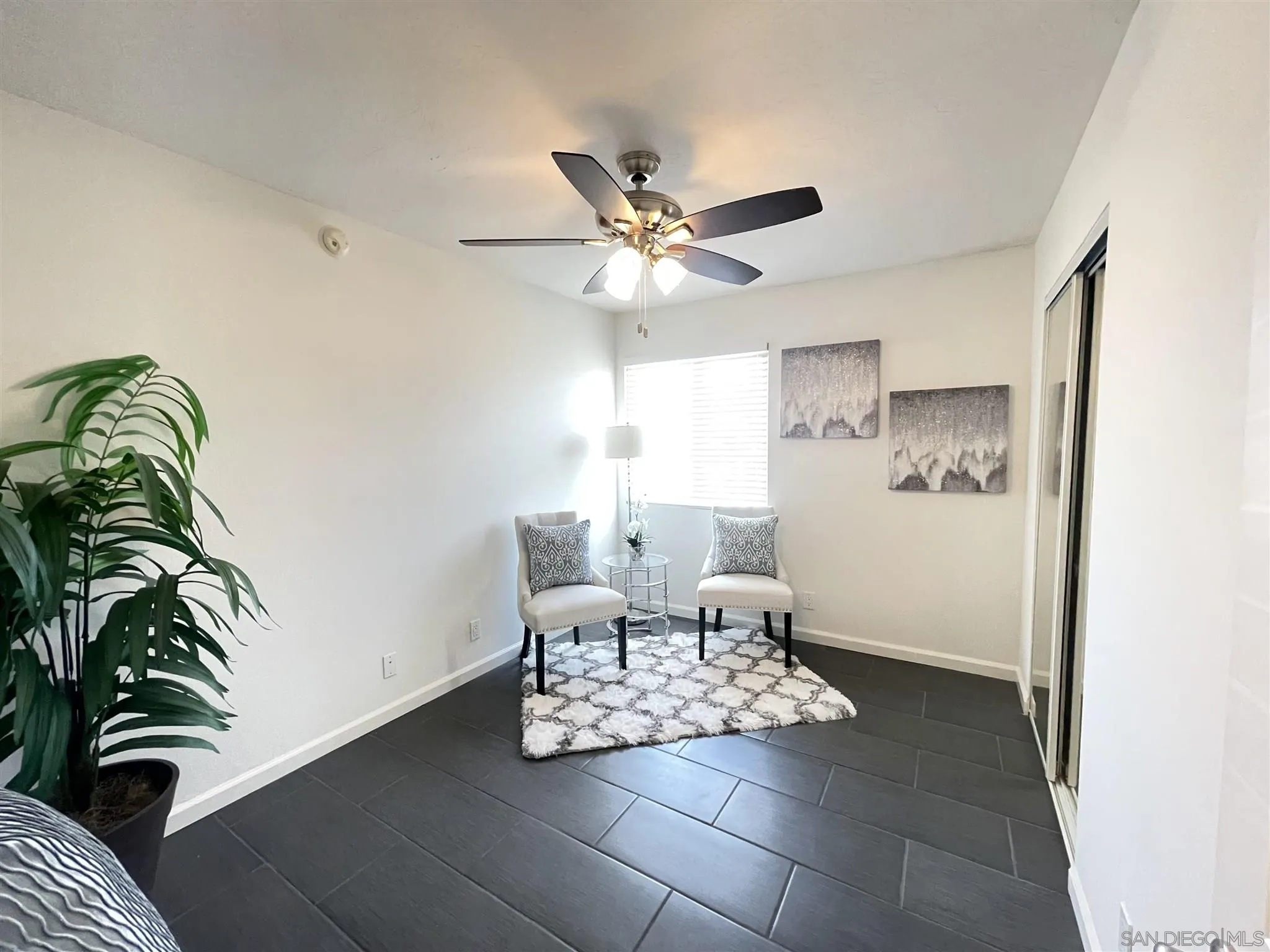 13717 Tobiasson Road Poway, CA 92064 - Photo 8 of 13 a living room with furniture and a potted plant