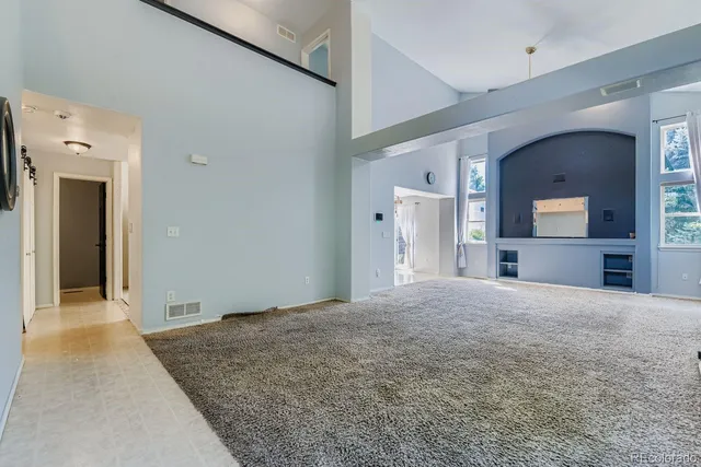 a big room with closet and a bathroom