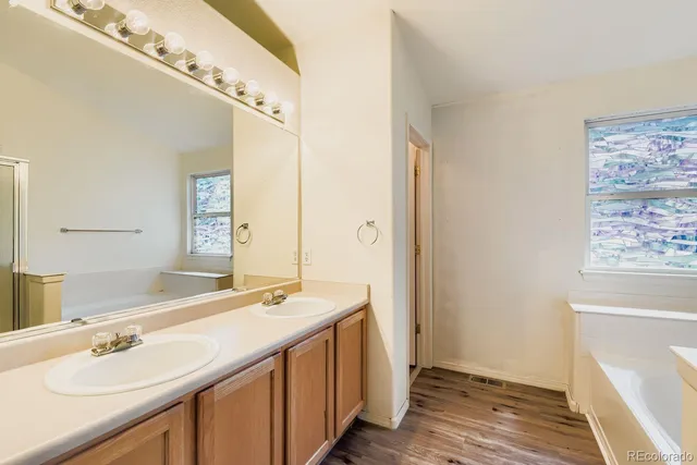 a living room with furniture and a ceiling fan