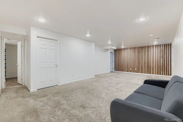 a view of a field with trees in background