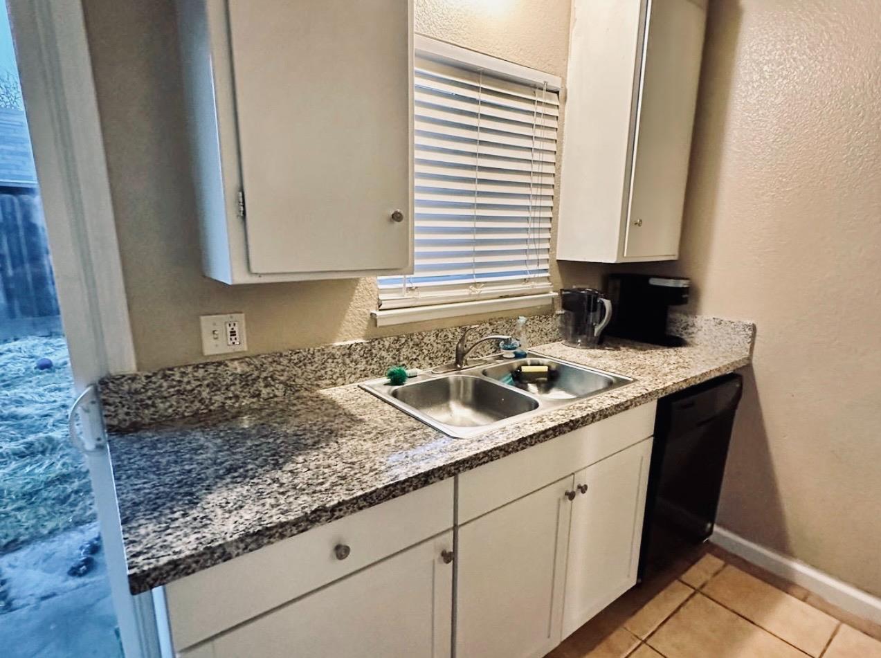 2045 Celeste Drive Modesto, CA 95355 - Photo 11 of 48 a kitchen with sink and window