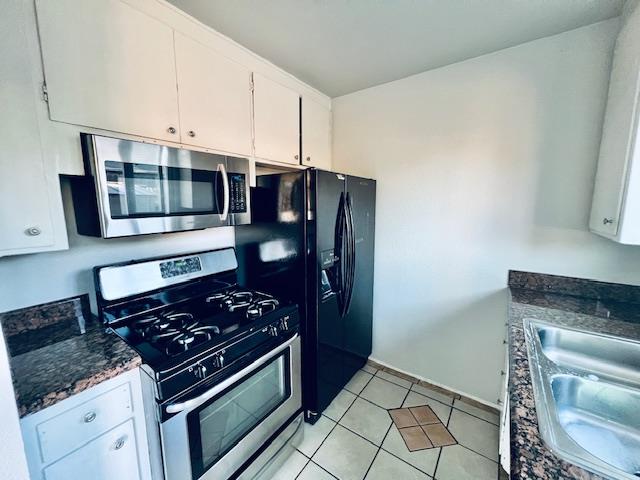 2045 Celeste Drive Modesto, CA 95355 - Photo 12 of 48 a kitchen with stainless steel appliances granite countertop a stove and a microwave