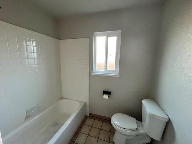2045 Celeste Drive Modesto, CA 95355 - Photo 16 of 48 a white toilet sitting next to a bath tub