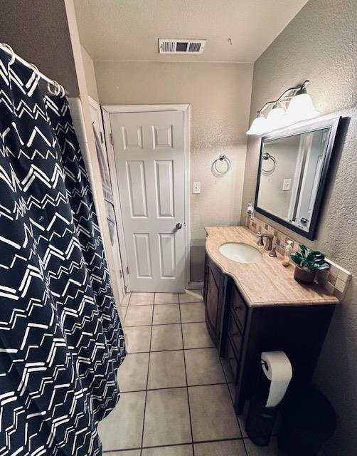 2045 Celeste Drive Modesto, CA 95355 - Photo 41 of 48 a bathroom with a sink and a mirror