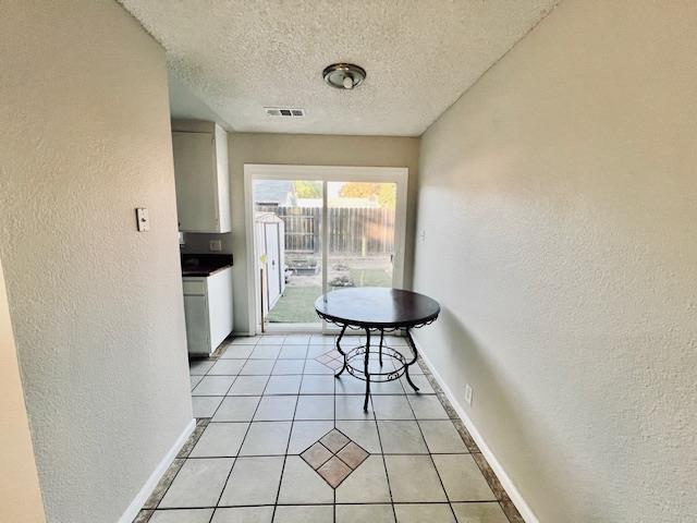 2045 Celeste Drive Modesto, CA 95355 - Photo 9 of 48 a view of empty room with wooden floor and fan