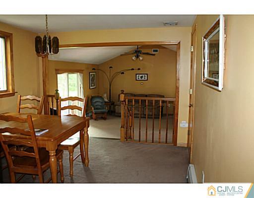 11 Butcher Road Monroe Township, NJ 08831 - Photo 11 of 18 a view of a dining area with furniture