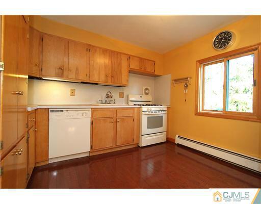 11 Butcher Road Monroe Township, NJ 08831 - Photo 13 of 18 a kitchen with stainless steel appliances granite countertop a sink window and cabinets