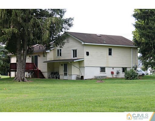 11 Butcher Road Monroe Township, NJ 08831 - Photo 3 of 18 a front view of house with yard