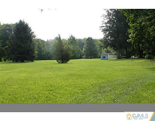 11 Butcher Road Monroe Township, NJ 08831 - Photo 4 of 18 a view of an outdoor space and a yard