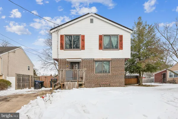 a view of a white house with a outdoor space