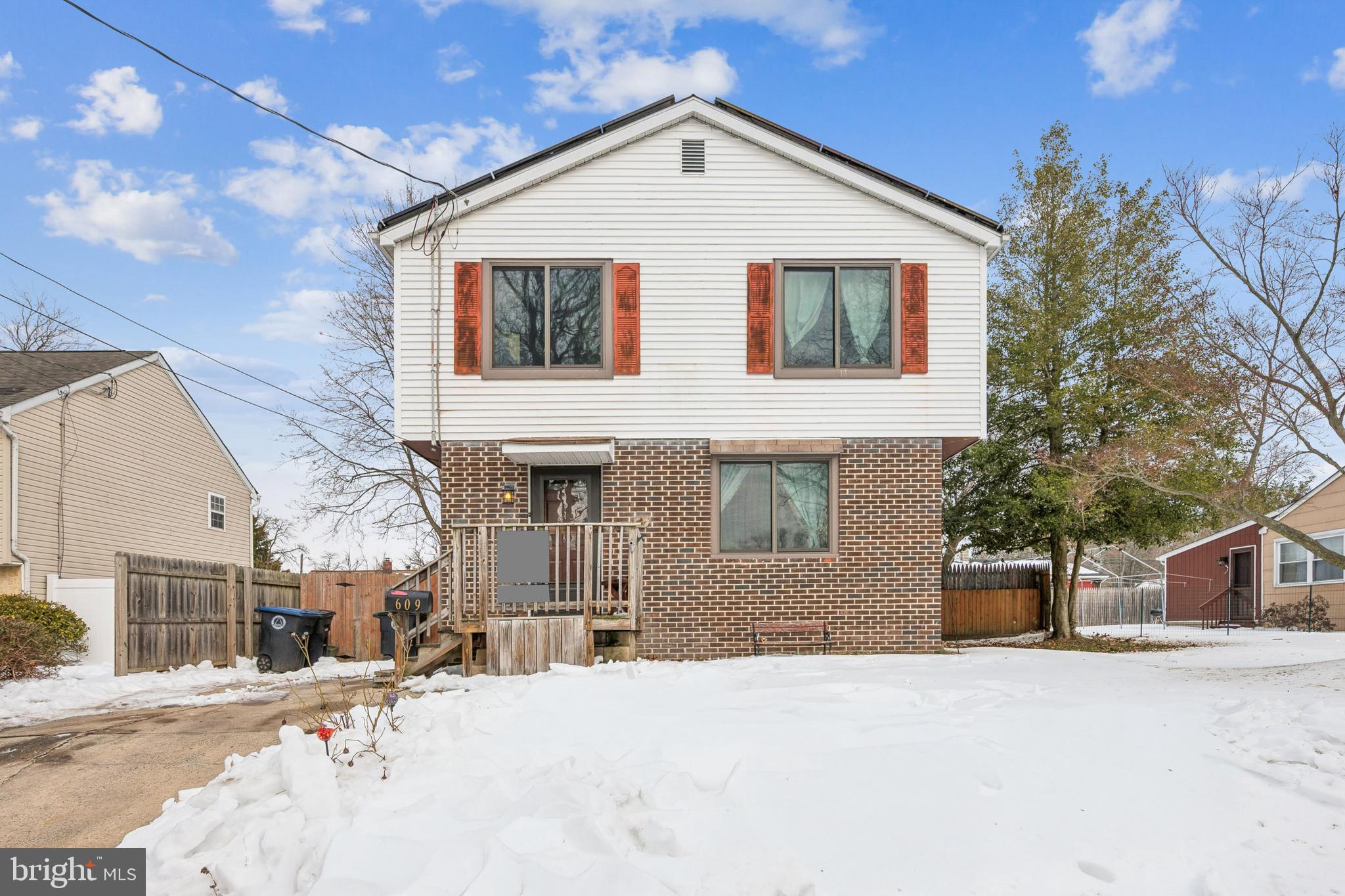 a view of a white house with a outdoor space