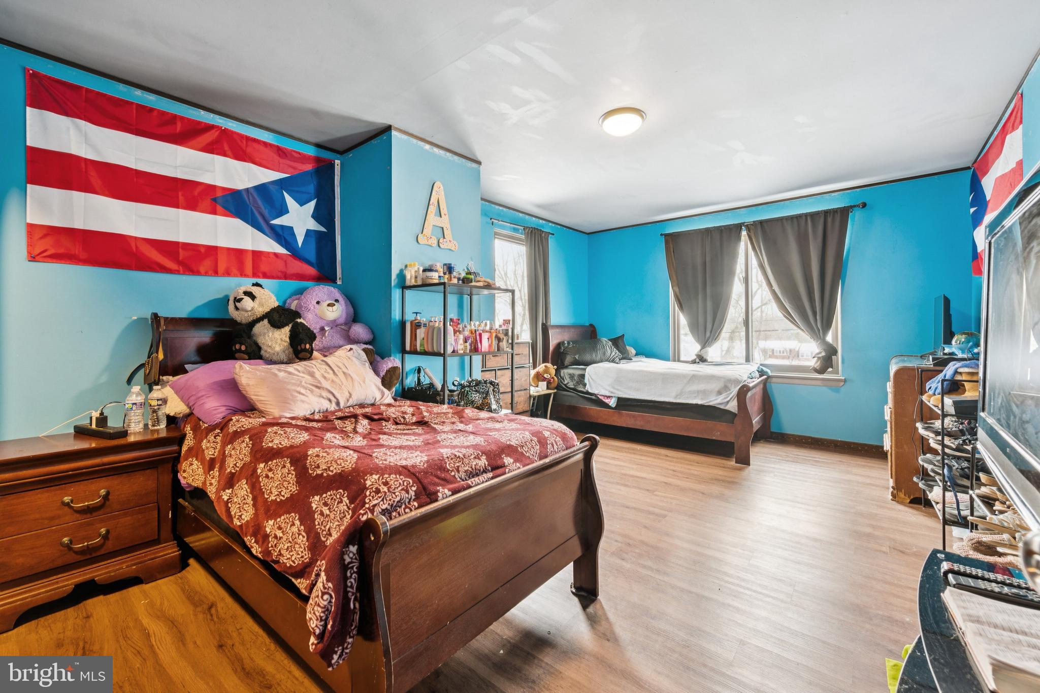 609 8th Avenue Lindenwold, NJ 08021 - Photo 20 of 25 a bedroom with a bed and wooden floor