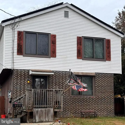a view of a house with iron fence