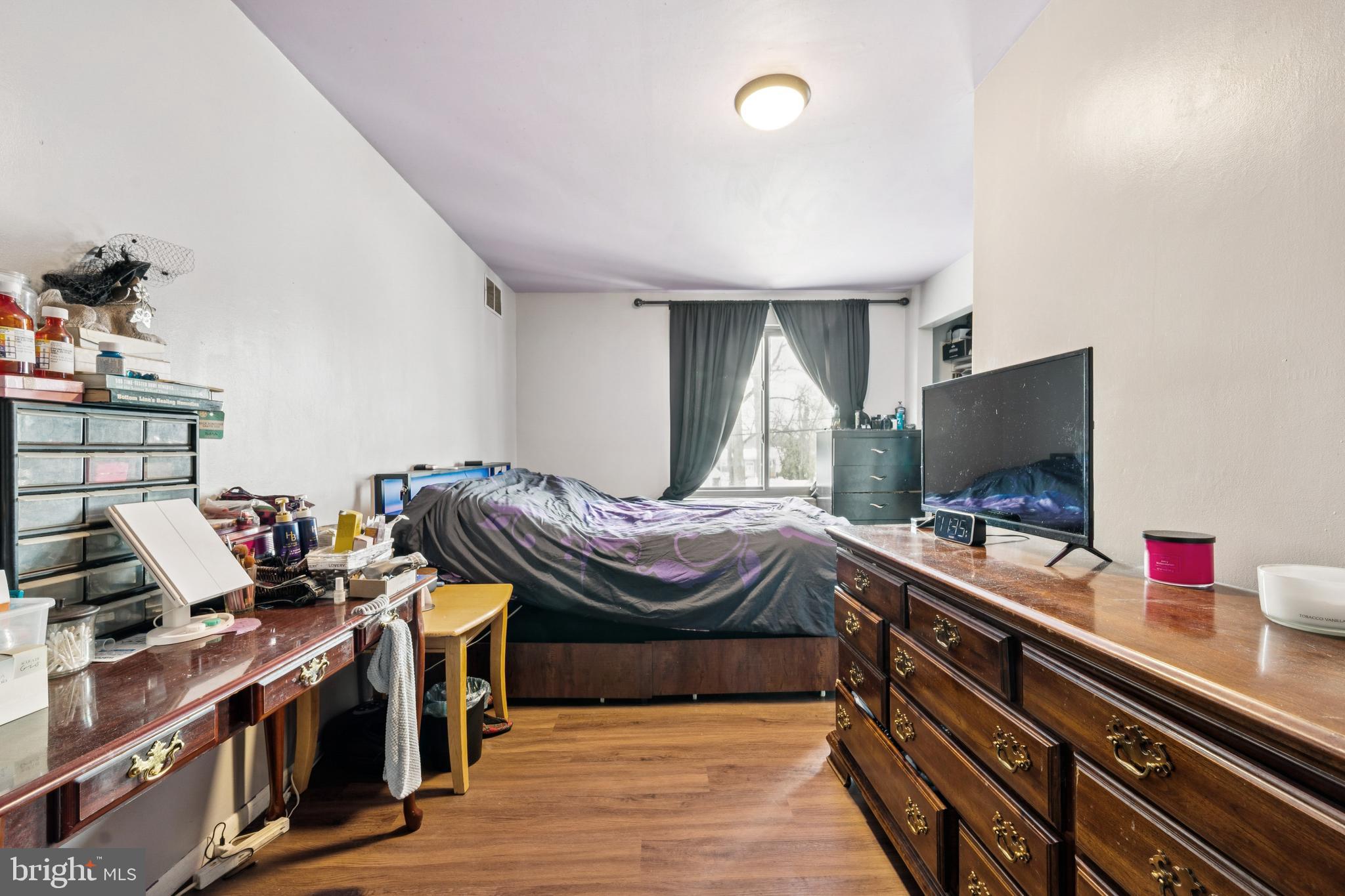 609 8th Avenue Lindenwold, NJ 08021 - Photo 21 of 25 a bedroom with a bed and a flat screen tv