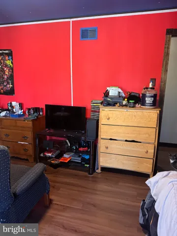 a bedroom with two beds and a closet