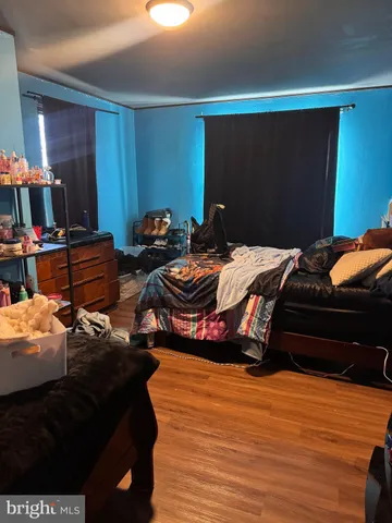 a bedroom with a bed and dresser