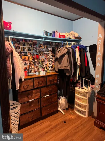 a bedroom with a bed and a closet