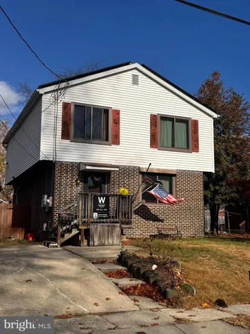 a front view of a house with parking