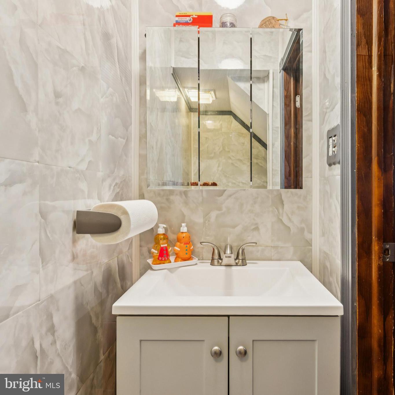 609 8th Avenue Lindenwold, NJ 08021 - Photo 5 of 25 a bathroom with a sink and a mirror