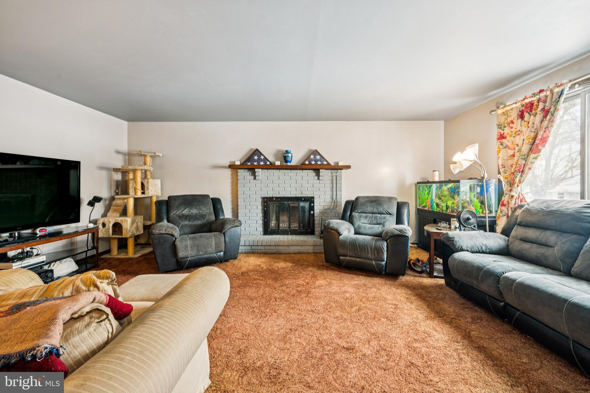 609 8th Avenue Lindenwold, NJ 08021 - Photo 6 of 25 a living room with furniture and a fireplace