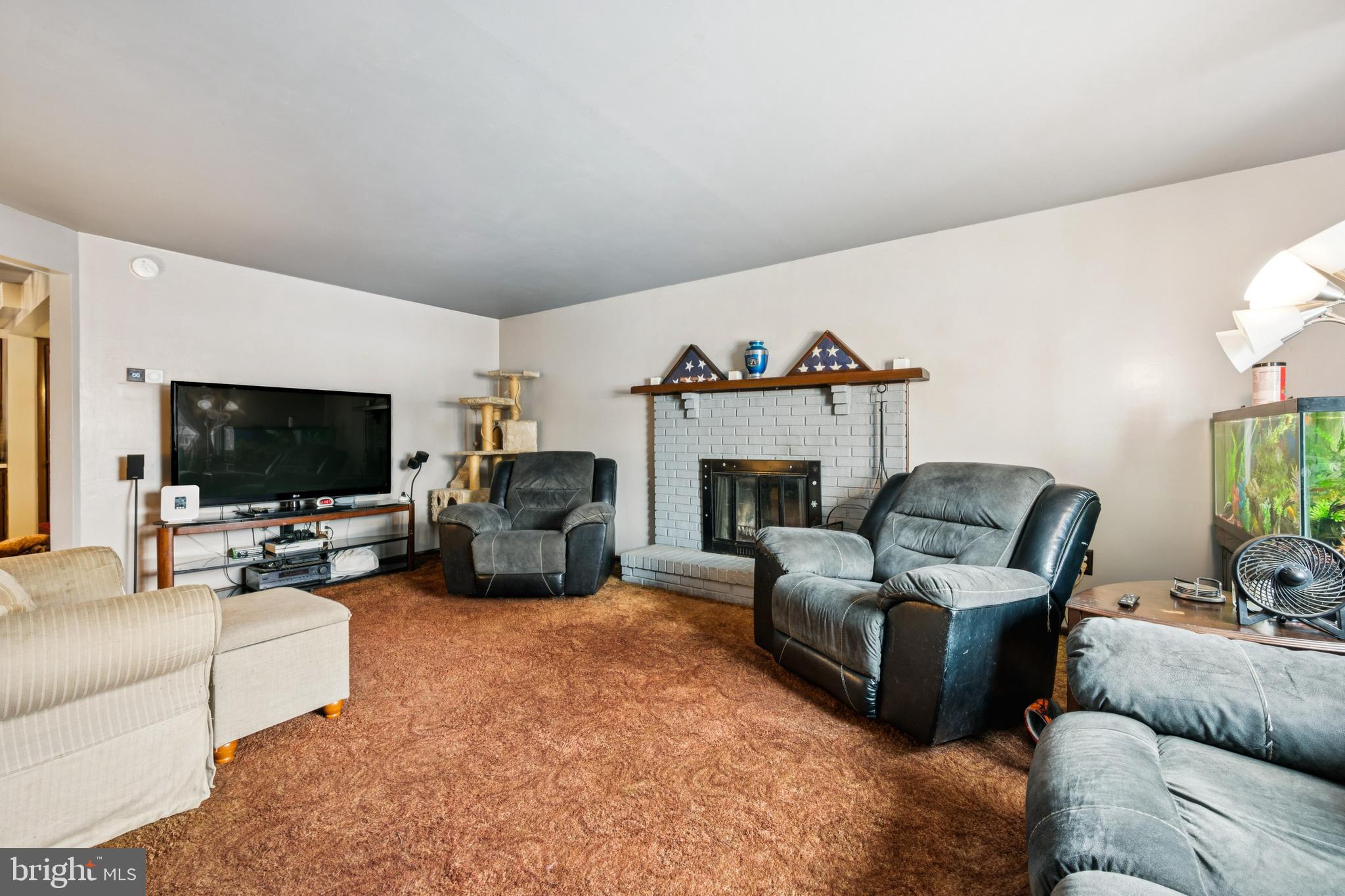 609 8th Avenue Lindenwold, NJ 08021 - Photo 7 of 25 a living room with furniture and a flat screen tv