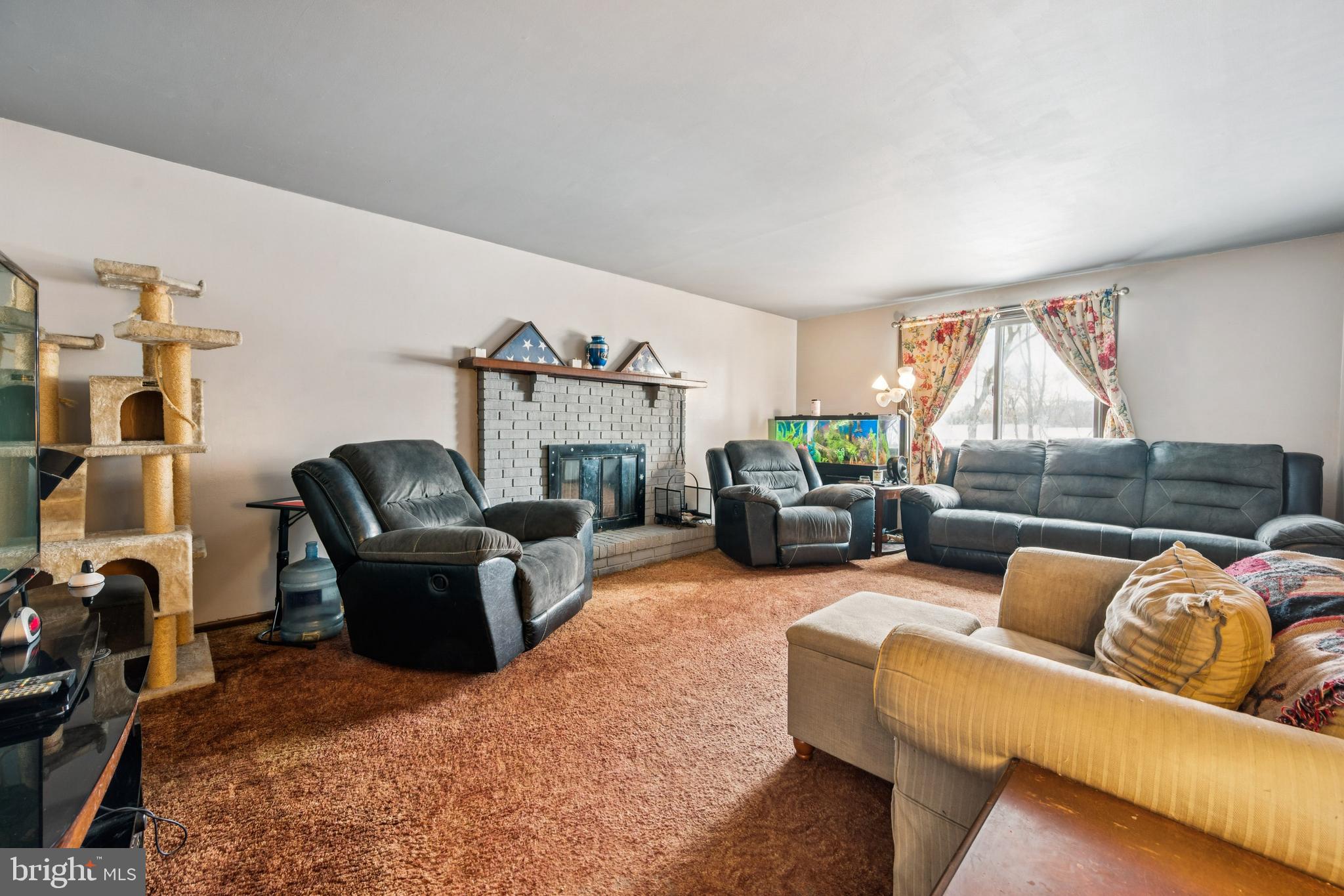 609 8th Avenue Lindenwold, NJ 08021 - Photo 8 of 25 a living room with furniture and a fireplace