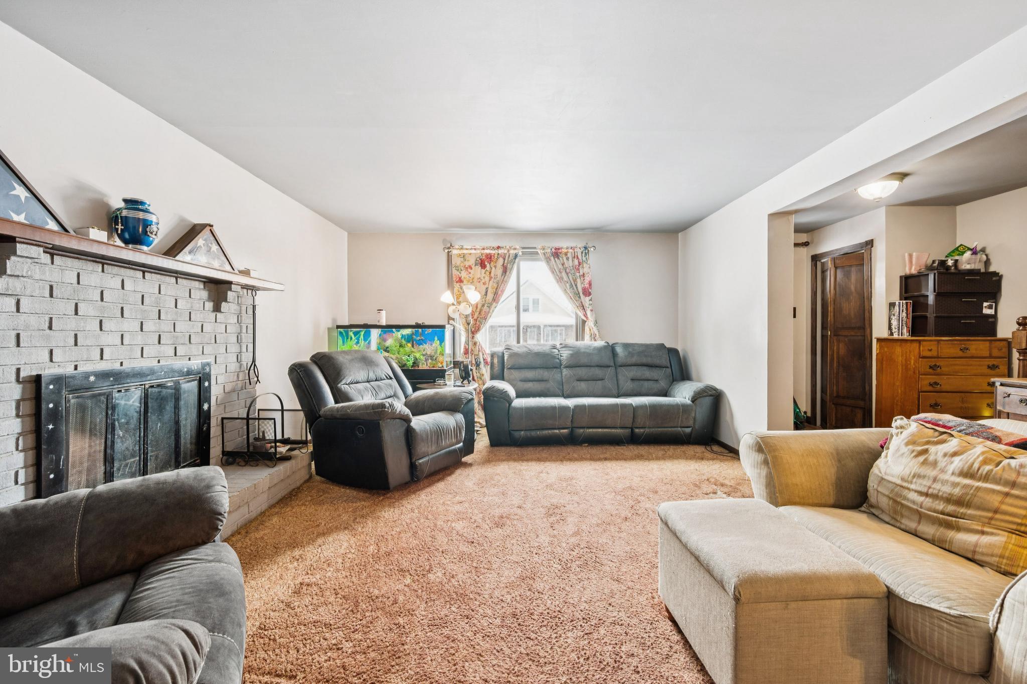 609 8th Avenue Lindenwold, NJ 08021 - Photo 9 of 25 a living room with furniture and a fireplace