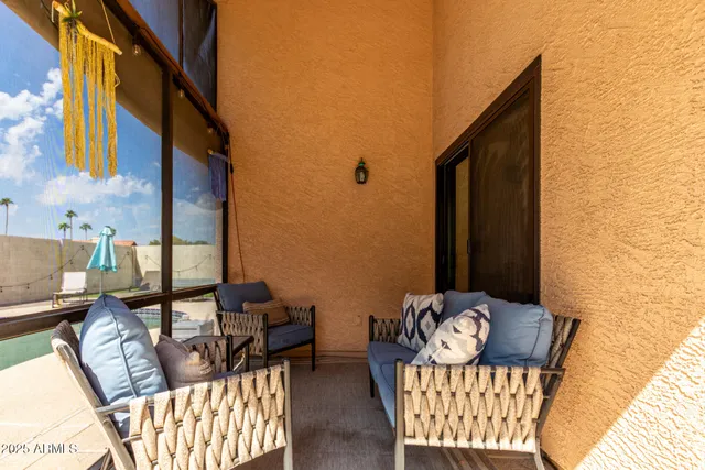 a view of balcony filled with furniture