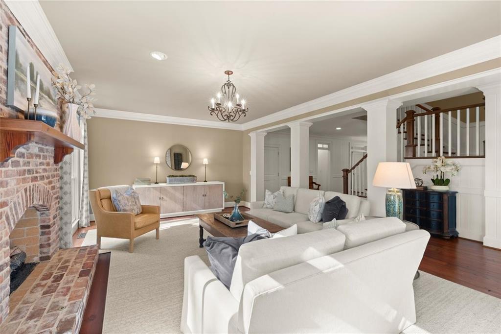 1450 Acworth Due West Road Northwest Kennesaw, GA 30152 - Photo 29 of 77 a living room with furniture and a chandelier