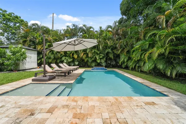 a view of a swimming pool with a patio