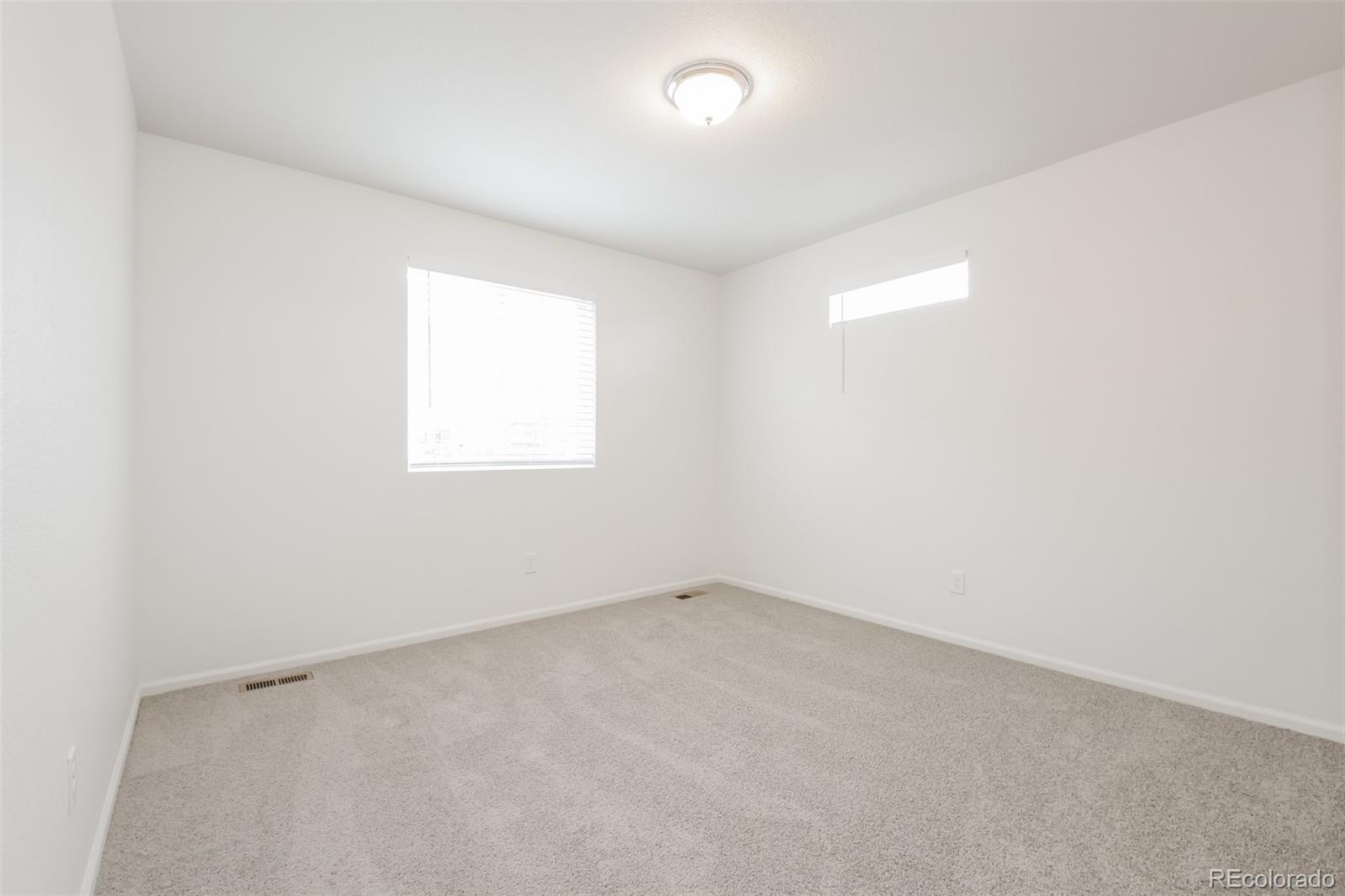 5383 Andes Street Denver, CO 80249 - Photo 11 of 18 an empty room with a window